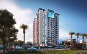 Modern high-rise residential building named Da Manara with balconies and glass facade, surrounded by palm trees, greenery, and cityscape under a clear blue sky.